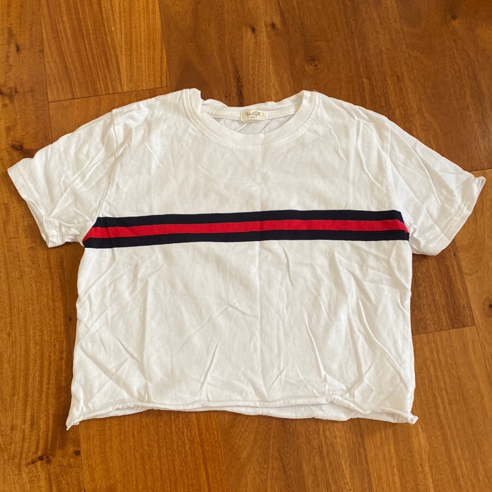 John Galt white tee with navy and red stripes. Size small.